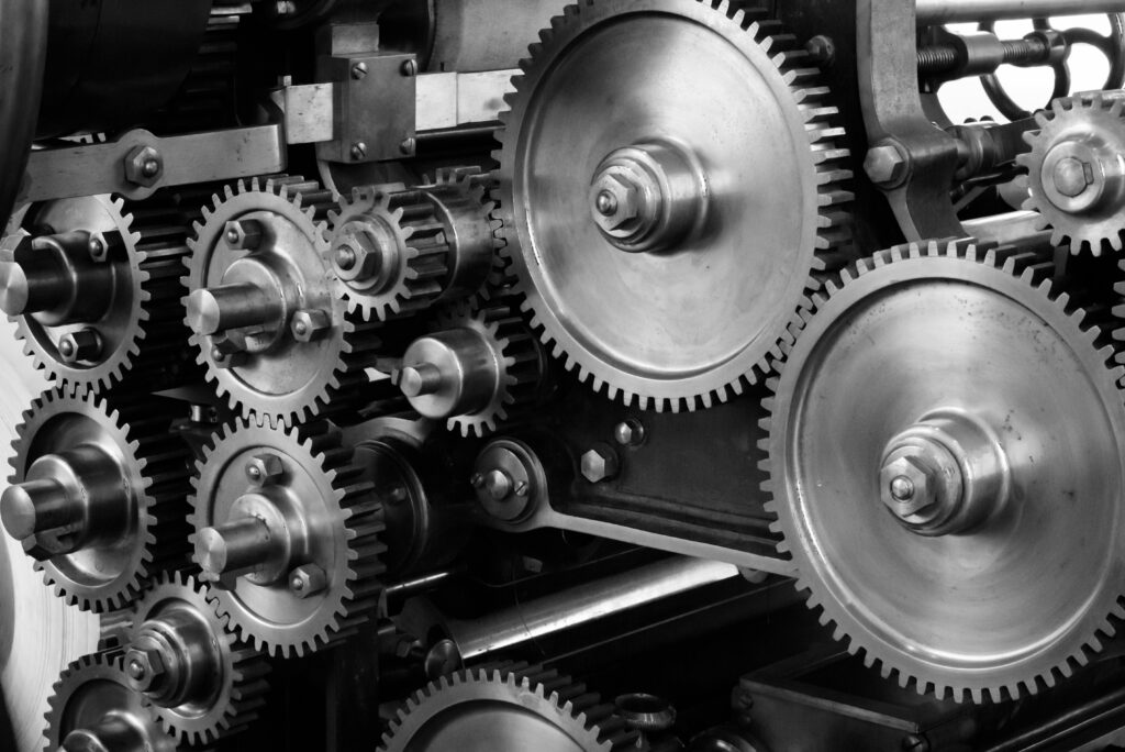 Marketing Automation Strategie: Klucz do Efektywności i Skalowalności System kół zębatych symbolizujący strategię marketing automation i automatyzację procesów marketingowych.